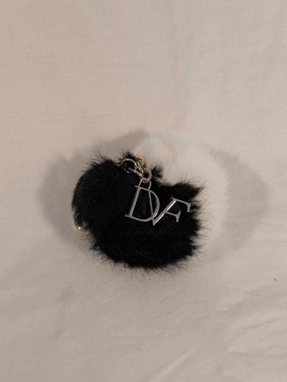 Diane Von Furstenberg Black and White Fur Pom Key Charm